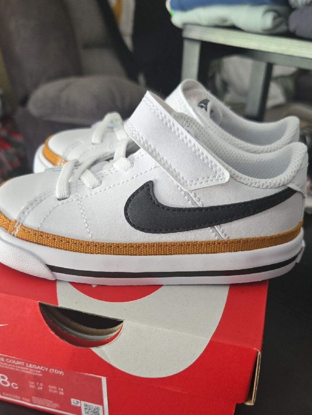 Nike Kids White Sneakers with Black Swoosh and Gold Accent - Picture 8 of 8